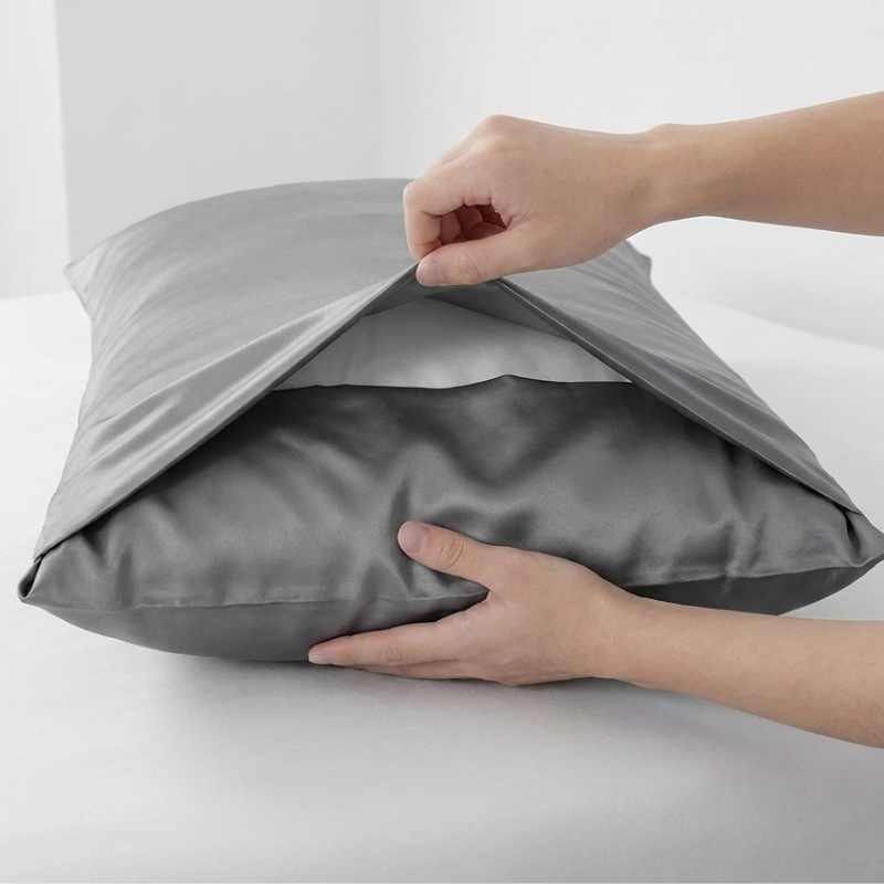 Envelope pillow cover with overlapping back panels that hold the pillow form inside